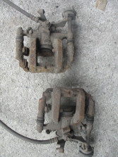 ASTRA J 1.4 T ZACISK HAMULCOWY LEWY TYŁ