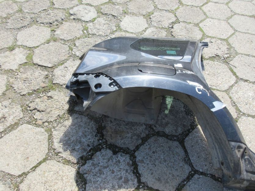 DACIA DUSTER I LIFT BŁOTNIK PRAWY TYŁ