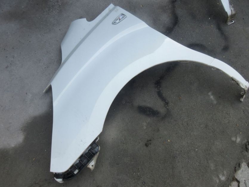 HYUNDAI H-1 II 2010 R. BŁOTNIK LEWY PRZÓD