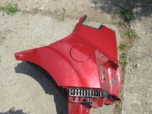 KIA VENGA BŁOTNIK LEWY TYŁ A0