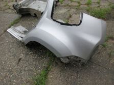 DACIA DUSTER I LIFT BŁOTNIK LEWY TYŁ