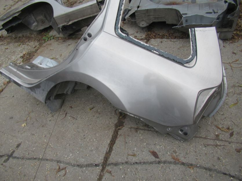 LOGAN II kombi MCV 2016 R. BŁOTNIK LEWY TYŁ