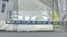 Emblemat Znaczek Napis modelu Kia RIO III IV 2011- OE 86310-1W000 NOWY ASO!